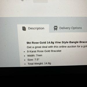 9k bangle bracelet with decorative 3rd dimension floral design at each end